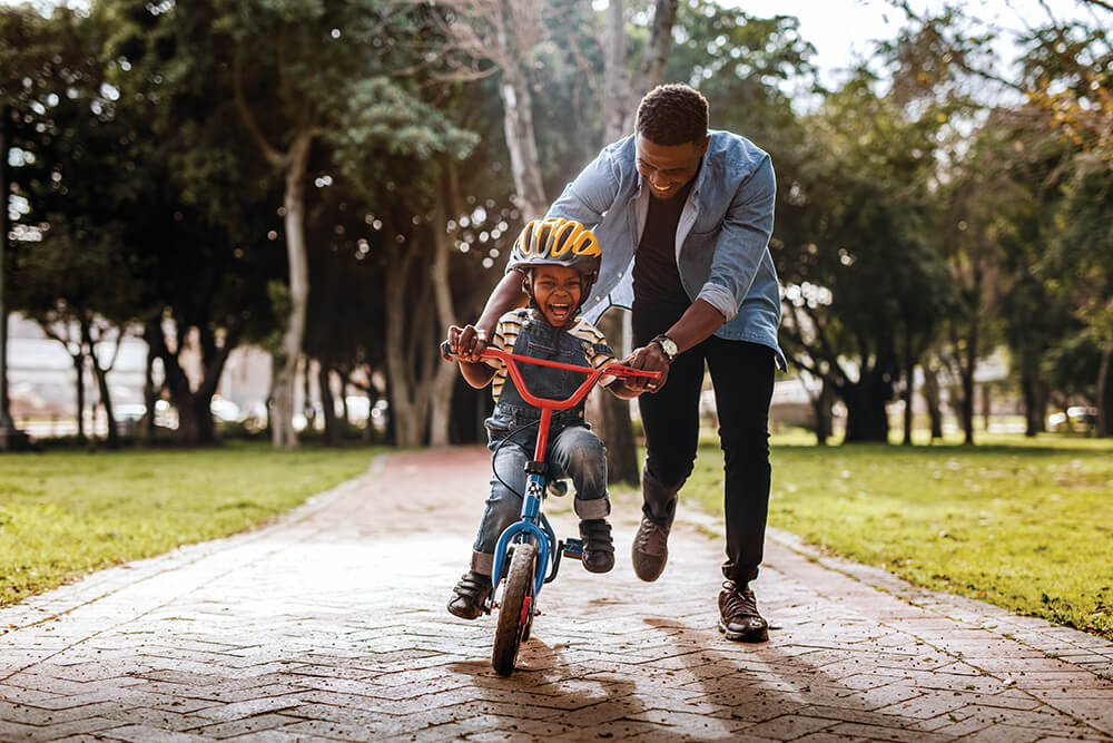 Boy Dad Bike Riding